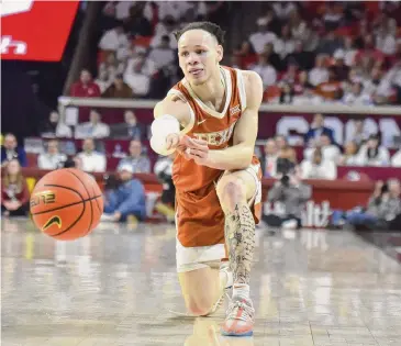  ?? Kyle Phillips/Associated Press ?? Chendall Weaver scored just five points but played tough defense to keep Texas close in its loss to No. 4 UH.