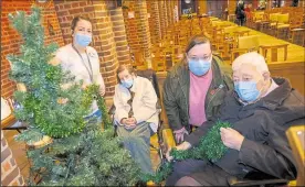  ?? Ref: 51-0321H ?? Staff and residents at Argyle Nursing home decorate their Christmas tree