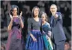  ??  ?? President Barack Obama stands on stage with his family after winning re- election on Tuesday.