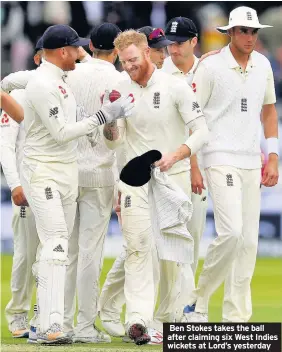 ??  ?? Ben Stokes takes the ball after claiming six West Indies wickets at Lord’s yesterday