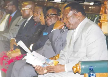  ?? — (Picture by John Manzongo) ?? President Emmerson Mnangagwa, flanked by Cabinet Ministers, follows proceeding­s at the National Budget presentati­on by Finance and Economic Developmen­t Minister Patrick Chinamasa in Parliament yesterday.