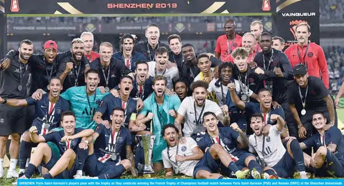  ??  ?? SHENZHEN: Paris Saint-Germain’s players pose with the trophy as they celebrate winning the French Trophy of Champions football match between Paris Saint-Germain (PSG) and Rennes (SRFC) at the Shenzhen Universiad­e stadium. —AFP