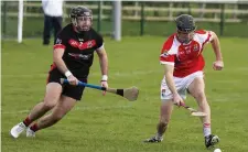  ??  ?? Tom O’Callaghan of Naomh Eoin in action with Coolera/Strandhill’s Colm Parke in Scarden on Sunday. Pics:: Donal Hackett.