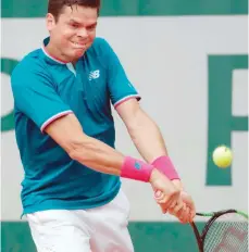  ?? — AFP ?? Canada’s Milos Raonic returns the ball to Spain’s Guillermo Garcia-Lopez.