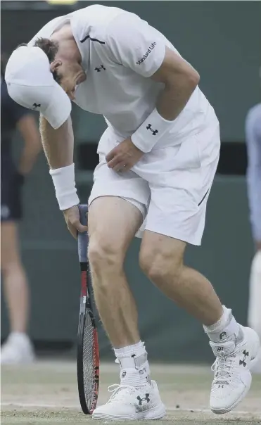  ??  ?? 0 The defending champion hunches over in pain from his persistent hip injury on his way to an exhausting five-set defeat in his quarter-final match against Sam Querrey, of the United States.