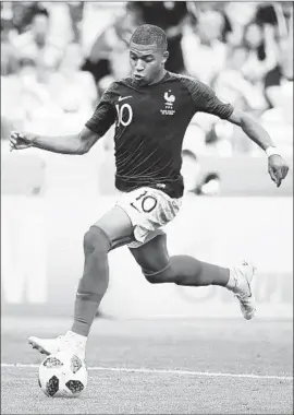  ?? Franck Fife AFP/Getty Images ?? KYLIAN MBAPPE, 19, of France became the first teenager to score two goals in a World Cup eliminatio­n game since Pele did it with Brazil in 1958.