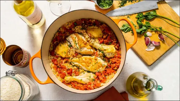  ?? COURTESY OF AMERICA’S TEST KITCHEN ?? This chicken dish features rice, white wine, tomatoes and parsley.