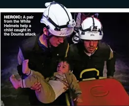  ??  ?? HEROIC: A pair from the White Helmets help a child caught in the Douma attack