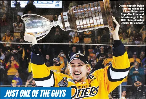  ?? AP ?? Otters captain Dylan Strome raises the J. Ross Robertson Cup after Erie beat Mississaug­a in the OHL championsh­ip earlier this month.