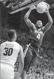  ?? AP/AJ MAST ?? Villanova forward Eric Paschall (4) dunks in front of Butler forward Kelan Martin (30) in the second half of the No. 1-ranked Wildcats’ 101-93 loss to the Bulldogs. Martin scored 24 points for Butler in the victory.