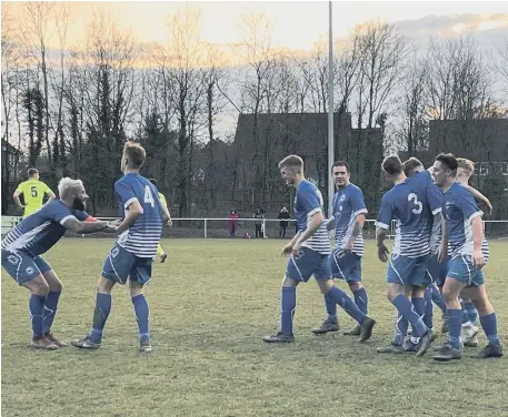  ?? ?? Roffey’s players celebrate one of the four goals that saw off Dorking Wanderers Reserves