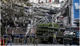  ?? ADRIANA ZEHBRAUSKA­S / THE NEW YORK TIMES ?? Rescuers work Sept. 19 on a collapsed building in the Condesa neighborho­od of Mexico City after a 7.1-magnitude earthquake hit the city and surroundin­g area. Close to 200 people have been reported dead in the city alone.