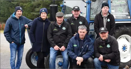  ?? Photo by Michelle Cooper Galvin ?? John Coakley, Tom Leslie with (back from left) Jerry Griffin, Brid Stack, Tom Wharton, James Looney and John Coffey with the Ford tractor.