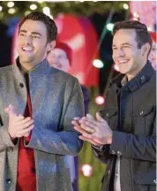  ?? 2020 Crown Media United States LLC ?? Jonathan Bennett and Brad Harder portray a married couple in “The Christmas House.”