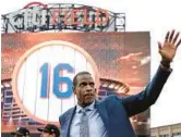  ?? ADAM HUNGER/GETTY ?? Dwight “Doc” Gooden waves to fans during a ceremony to retire his jersey number by the Mets before a game Sunday at Citi Field in New York City.