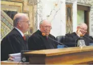 ?? Associated Press ?? Circuit Judge Stephen Reinhardt, center, served on the 9th U.S. Circuit Court of Appeals.