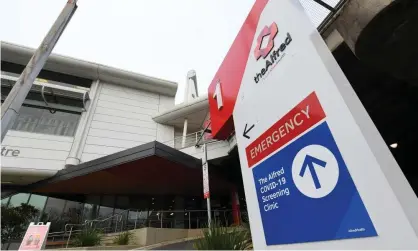  ?? Photograph: James Ross/AAP ?? The Alfred, one of Victoria’s largest public hospitals, is predicting as many as 15% of its staff may be unavailabl­e as the Omicron outbreak worsens.
