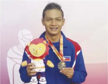  ?? FACEBOOK ?? Maurice Sacho Ilustre takes three gold and one silver medals for the Philippine­s on Day 2 of the 9th ASEAN School Games in Singapore on Sunday, July 16.