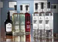  ??  ?? =Boardroom Spirits’ line of local craft liquors includes triple sec, flavored vodkas, gin and rum.