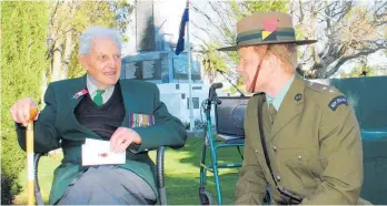  ?? Photo / NZME ?? Bonny, then 94, with Richard Short, now Dannevirke RSA president, during a remembranc­e service.