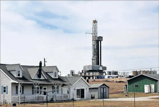  ?? [COURTNEY HERGESHEIM­ER/DISPATCH] ?? This Belmont County farmhouse shares its backyard with the Eclipse-owned Boyd Hall well pad. Belmont County, in eastern Ohio, produced more natural gas and brine waste from fracking in the first quarter of this year than any other Ohio county.