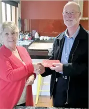  ??  ?? Right: Club 88 president Kaye Williams presents a cheque for $2000 to John Ellams of Mawarra to help with the refurbishm­ent of the Mawarra Shop.