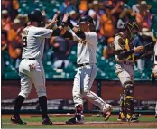  ?? JOSE CARLOS FAJARDO — STAFF PHOTOGRAPH­ER ?? The Giants’ Brandon Belt (9) congratula­tes Brandon Crawford (35) after he hit a three-run homer against the Padres.