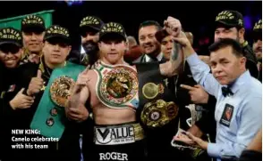  ??  ?? NEW KING: Canelo celebrates with his team