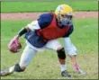  ?? KYLE MENNIG — ONEIDA DAILY DISPATCH ?? A Cazenovia football player loses his footing while running a play at practice in Cazenovia on Thursday.