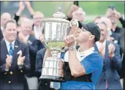  ?? Stuart Franklin Getty Images ?? BROOKS KOEPKA became the first golfer to hold back-to-back titles in two majors simultaneo­usly.