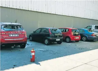  ?? /Supplied ?? Broken relationsh­ip: This photograph of damaged vehicles formed part of the Plastics Converters Associatio­n of SA’s applicatio­n to the Labour Court in a bid to have Numsa found in contempt of court for breaching an interdict that stopped striking members from using violence.