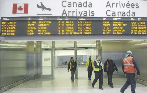  ?? NATHAN DENETTE / THE CANADIAN PRESS ?? A sign at Pearson Internatio­nal Airport in Toronto is displayed in both English and French.