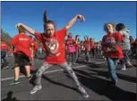  ??  ?? French Creek Elementary School fourth-grade students, Alexis Little and Cadence Helms took part in a dance party following the walkathon.