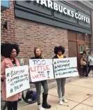  ?? RON TODT/AP ?? Protesters gather outside the Philadelph­ia Starbucks where two black men were arrested.