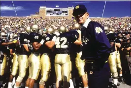  ?? JONATHAN DANIEL / ALLSPORT ?? Lou Holtz coached Notre Dame to a 31-30 victory over Miami in 1988 en route to a 12-0 season and national title. The game takes up a half-hour of the 100-minute “Catholics vs. Convicts” documentar­y to air in ESPN’s “30 for 30” series.