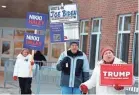  ?? MICHAEL DWYER/AP ?? Candidate supporters outside a primary polling place Tuesday in Windham, N.H.