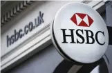  ??  ?? HSBC bank logo is seen on a sign outside a branch of the bank in central London yesterday. —AFP