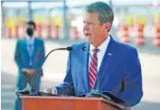  ?? ELIJAH NOUVELAGE/GETTY IMAGES/TNS ?? Georgia Gov. Brian Kemp speaks at a news conference on Aug. 10, 2020, in Atlanta.