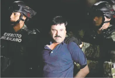  ?? ALFREDO ESTRELLA / AFP VIA GETTY IMAGES FILES ?? Mexican Drug kingpin Joaquin (El Chapo) Guzman is escorted into a helicopter at Mexico City's airport. Toronto
trucker Mykhaylo Koretskyy has pleaded guilty to conspiring with Guzman to import cocaine into the U.S.