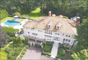  ?? Photos by Halstead Connecticu­t ?? Left: The formal living room features coffered ceilings and a fireplace. Right: The renovated 1908 Greek revival estate at 16 East Trail in Darien is on 2.89 acres.