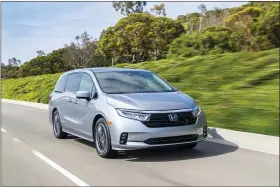  ?? HONDA VIA AP ?? This shows the 2021 Honda Odyssey, which has been Edmunds’ top-rated minivan since this generation was introduced in 2018. For 2021 it gets a mild update.