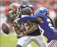  ?? Jason Behnken / Associated Press ?? The Buccaneers’ Mike Evans has a pass knocked away by the Giants’ Janoris Jenkins on Oct. 1 in Tampa, Fla.