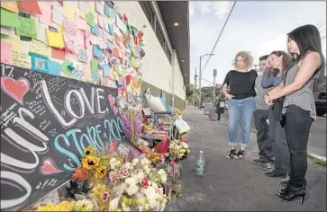  ?? Allen J. Schaben Los Angeles Times ?? LYNNE WESTAFER, left, Mike D’Angelo, MaryLinda Moss and Kat Quid share their experience­s Tuesday outside the Trader Joe’s in Silver Lake, where they were held hostage during a three-hour standoff on July 21.