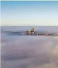  ??  ?? Ely Cathedral, Cambs – known as The Ship of the Fens – stands above low-lying fog