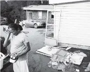  ?? AP ?? Seema Depani helps her family to clean up after the flooding from Hurricane Florence destroyed the Starlite Motel, which her family owns in Spring Lake, North Carolina.