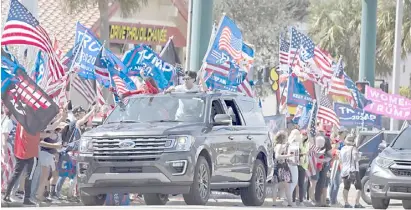  ?? JOE RAEDLE/AGENCE FRANCE-PRESSE ?? SUPPORTERS of former US President Donald Trump gather near his Mar-a-Lago home in West Palm Beach, Florida last Monday, 15 February, which coincided with President’s Day to show their continued support to him after his 2020 election loss to President Joe Biden.