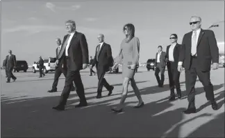  ?? STEPHEN CROWLEY / NEW YORK TIMES FILE (2017) ?? President Donald Trump meets his wife, Melania, after arriving in West Palm Beach, Fla.