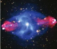  ?? ?? Composite image of Cygnus A, our closest powerful radio galaxy. X-ray data is presented in blue and radio emissions in red
Artist’s concept of the possible rings surroundin­g Rhea
An artist’s impression of a distant hypothetic­al solar system that is a similar age to our own