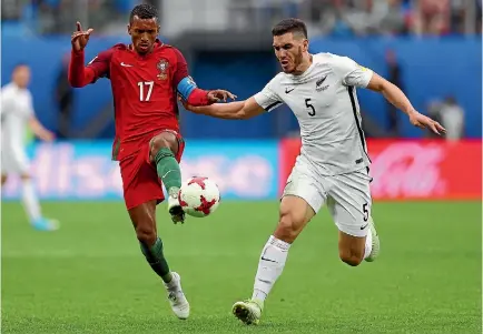  ?? GETTY IMAGES ?? Michael Boxall keeps Portugal star Nani on a tight leash during their clash at the Confederat­ions Cup.