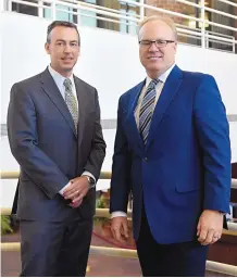  ?? DEAN HANSON/JOURNAL ?? Outgoing Presbyteri­an Healthcare CEO Jim Hinton, right, believes interim CEO Dale Maxwell, left, would be a great successor.